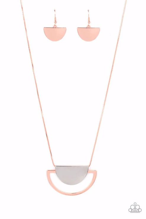 Rose gold necklace and earrings on a white background