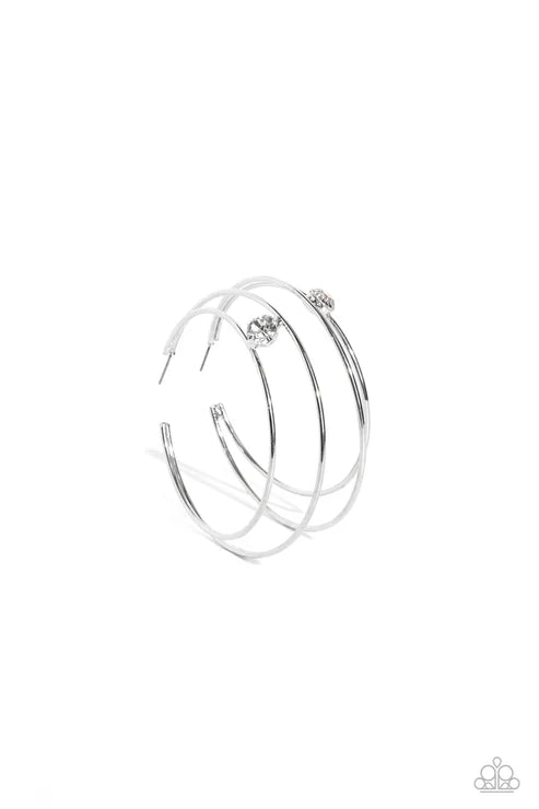 Set of silver bangles on a white background