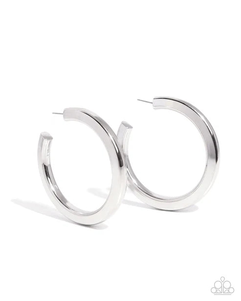Pair of silver hoop earrings on a white background