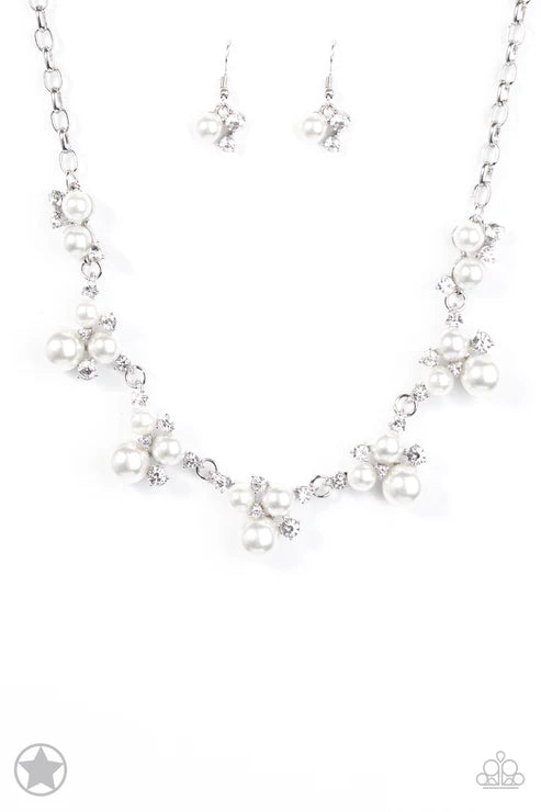 Silver necklace with star-shaped pendants on a white background