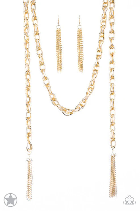 Gold chain necklace and earrings on a white background