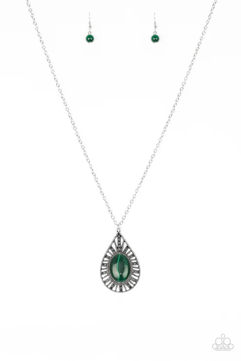 Silver necklace with green teardrop pendant on a white background