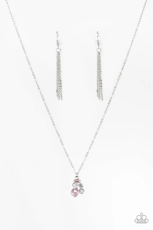 Silver necklace with a pink pendant on a white background