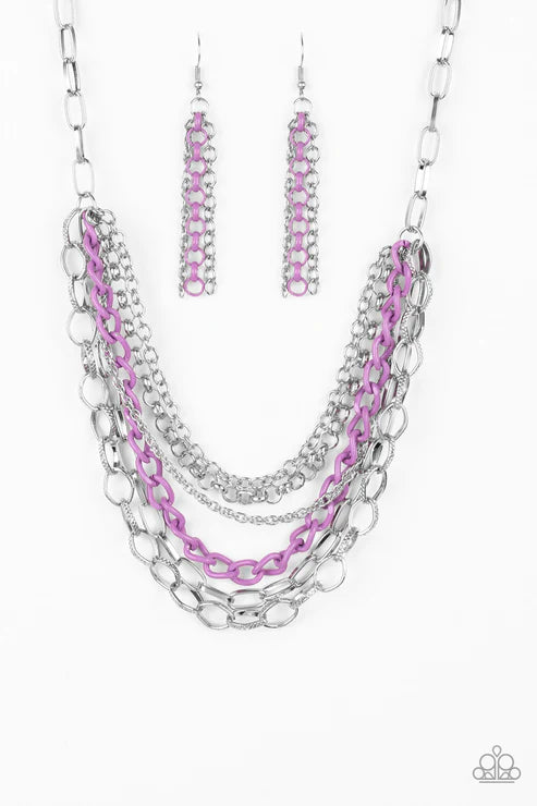Necklace and earrings set with pink and silver chains on a white background