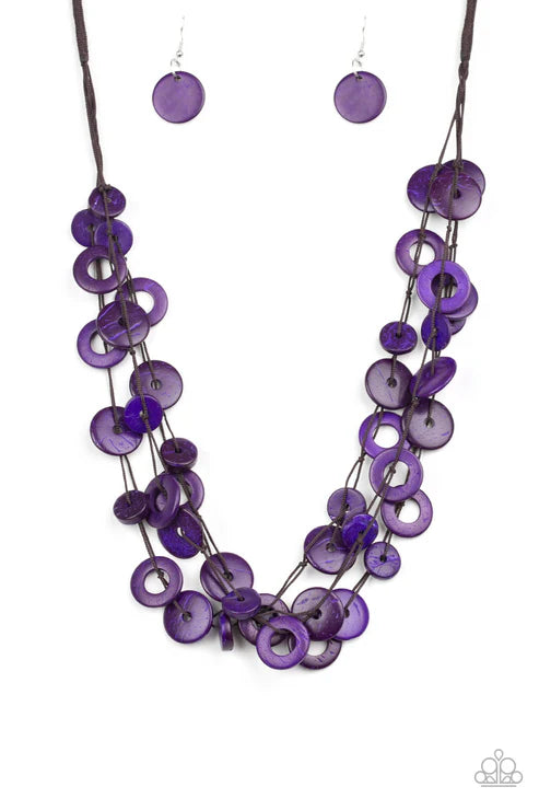 Purple beaded necklace and earrings on a white background