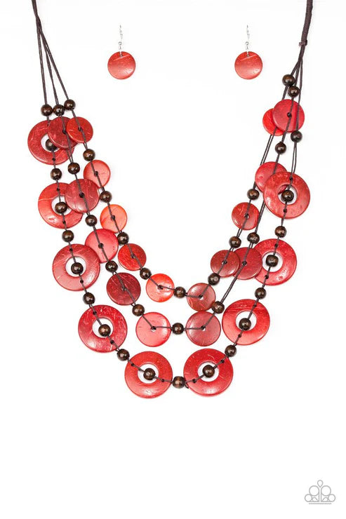 Necklace with red circular beads and brown beads on a white background