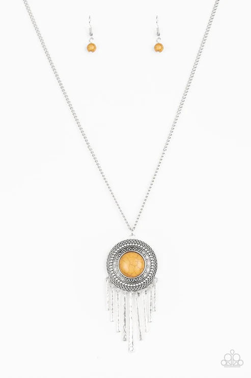 Necklace with pendant and matching earrings on a white background