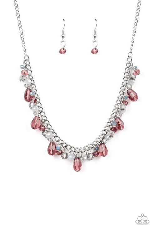 Necklace and earrings set with pink beads on a white background