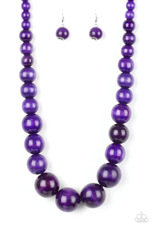 Purple beaded necklace and earrings on a white background