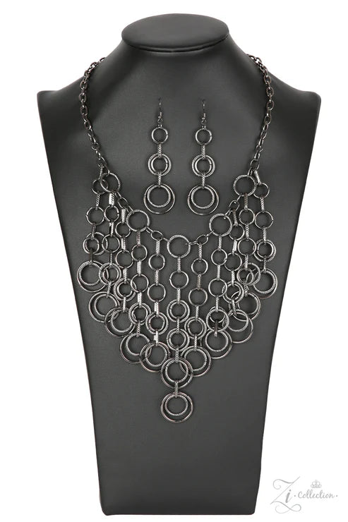 Black circular jewelry set on a black mannequin bust