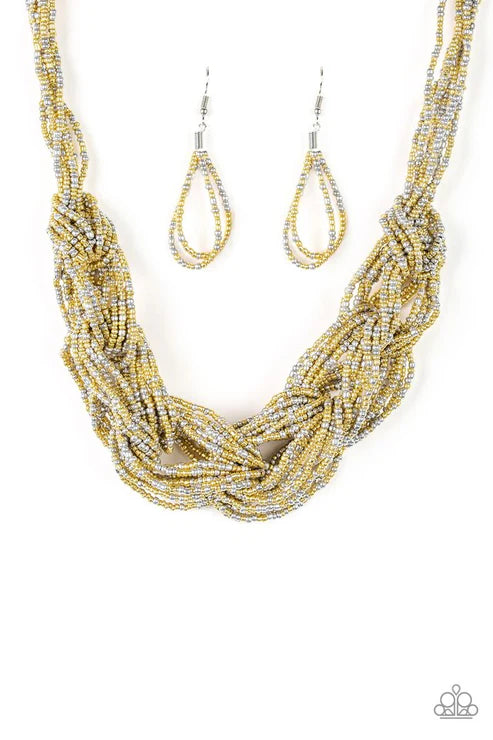 Gold and silver beaded necklace and earrings on a white background