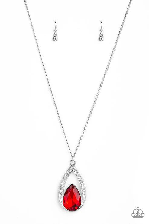 Silver necklace with a red teardrop pendant on a white background