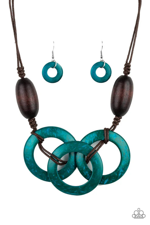 Teal circular necklace and earrings with brown accents on a white background