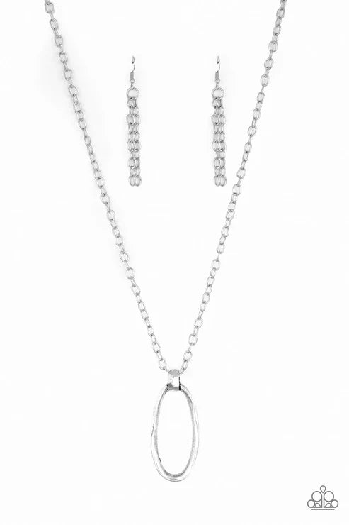 Silver necklace and earrings set on a white background