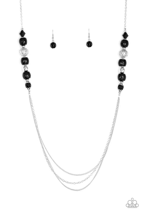 Necklace with black beads and silver chain on a white background