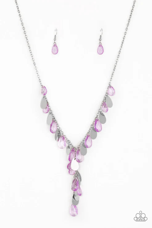 Necklace and earrings set with pink and silver stones on a white background