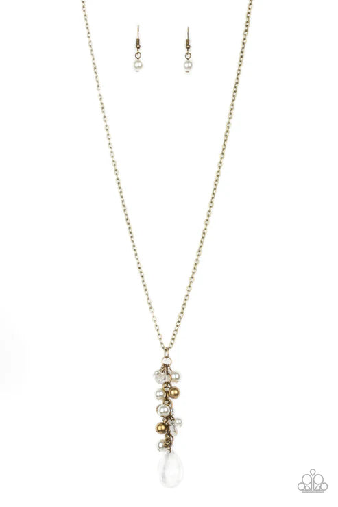 Necklace with gold and white beads on a white background