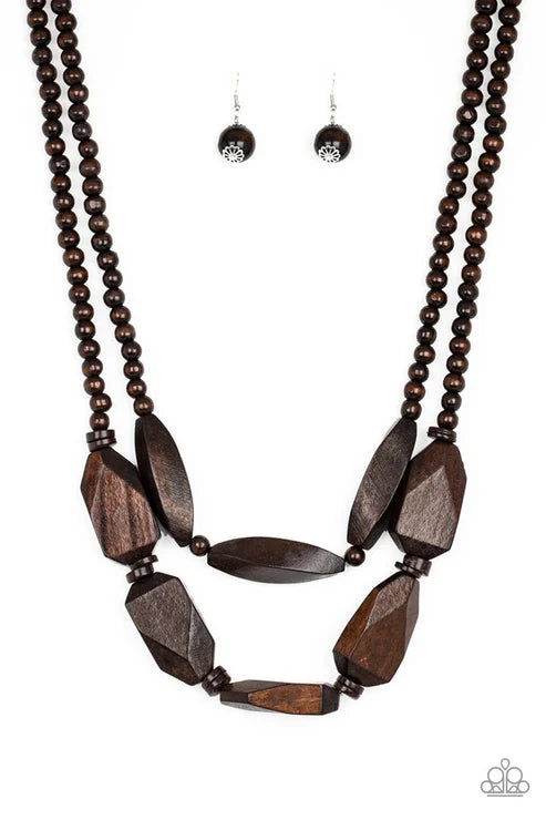 Brown beaded necklace with large wooden beads and matching earrings on a white background