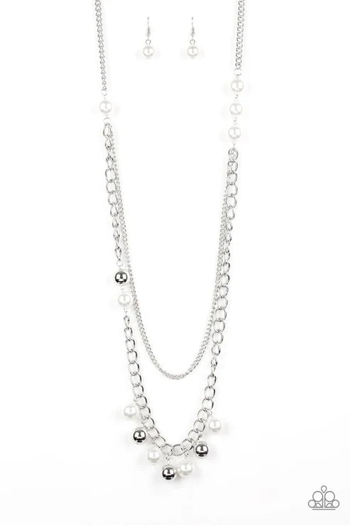 Silver necklace and earrings on a white background