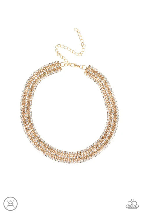 Gold beaded necklace on a white background