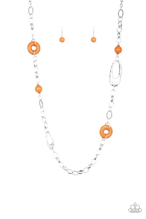 Necklace with orange circular beads and silver chain on a white background