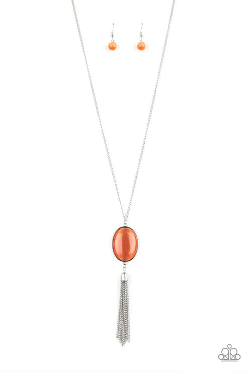 Necklace with orange pendant and silver tassel on a white background
