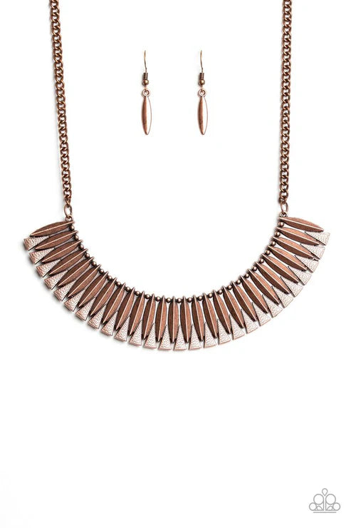 Rose gold fringe necklace and earrings on a white background