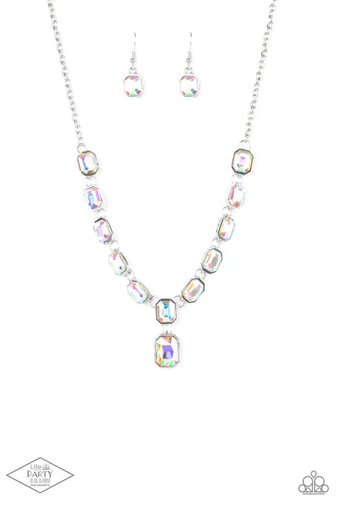 Necklace and earrings set with multicolored gemstones on a white background