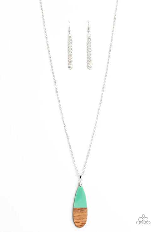 Necklace with a green and wood pendant on a white background
