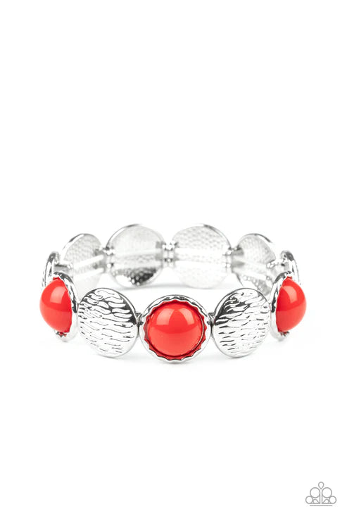 Silver bracelet with red beads on a white background