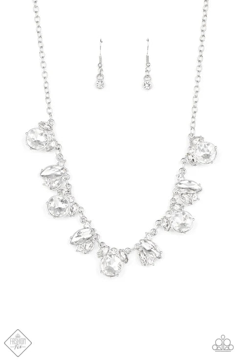 Silver necklace with clear crystals on a white background