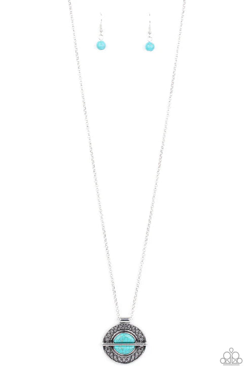 Turquoise pendant necklace and earrings on a white background