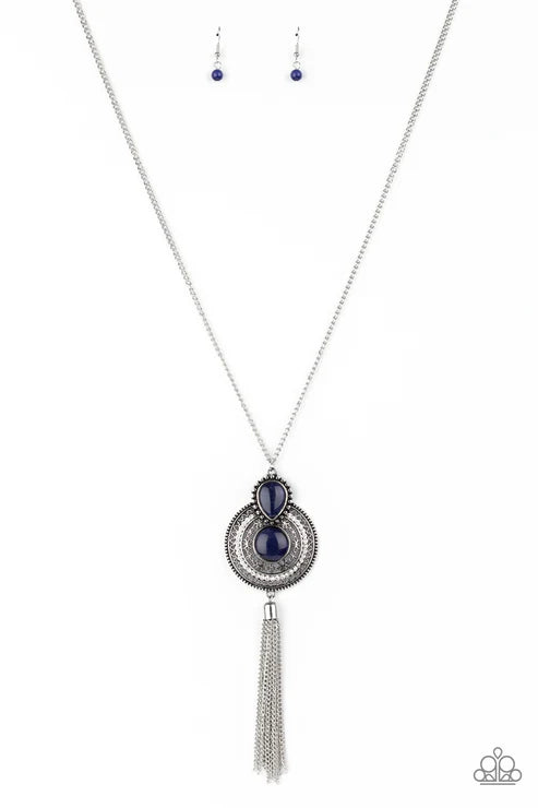 Necklace with tassel and blue gemstone on a white background