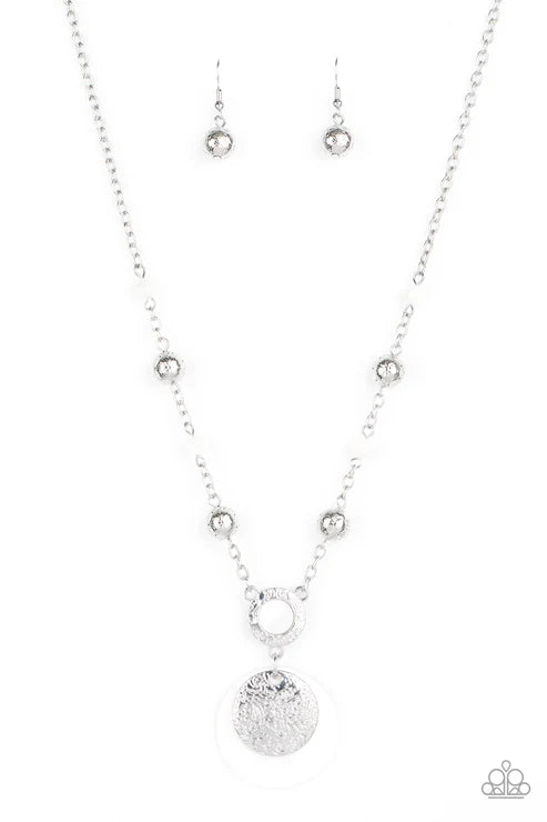 Silver necklace and earrings on a white background