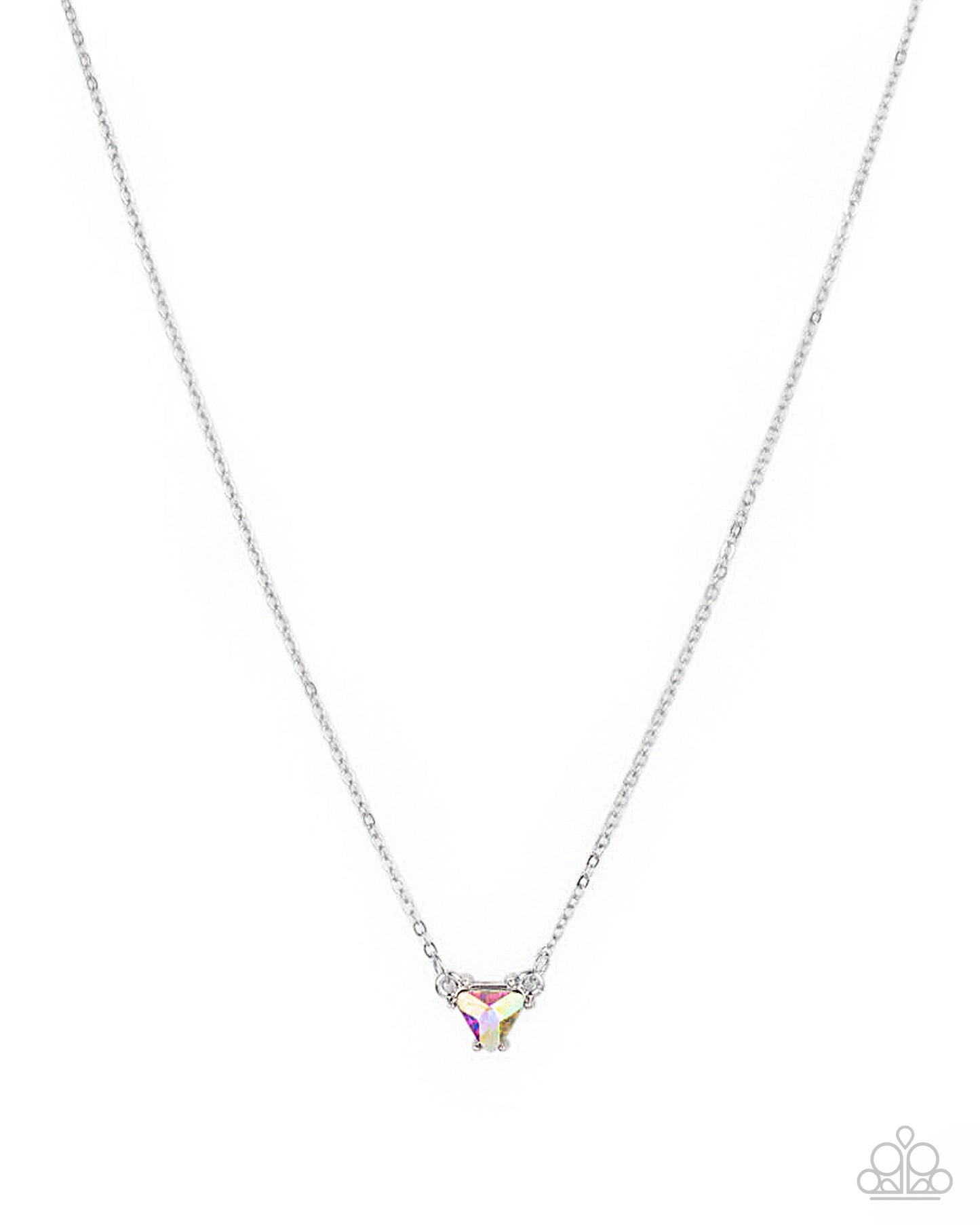 A silver chain necklace with a small triangular pendant featuring a clear faceted stone and tiny iridescent accents, shown on a plain white background. A small Paparazzi-style logo watermark appears in the bottom right corner.