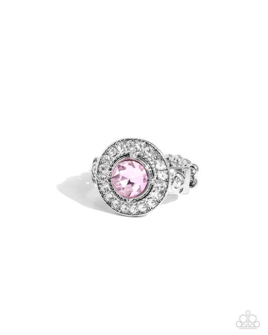 Silver ring with a pink gemstone on a white background