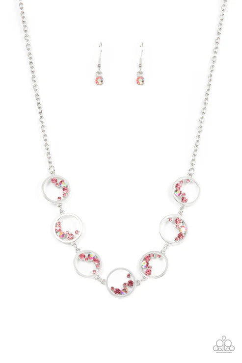 Necklace and earrings set with circular links and red accents on a white background