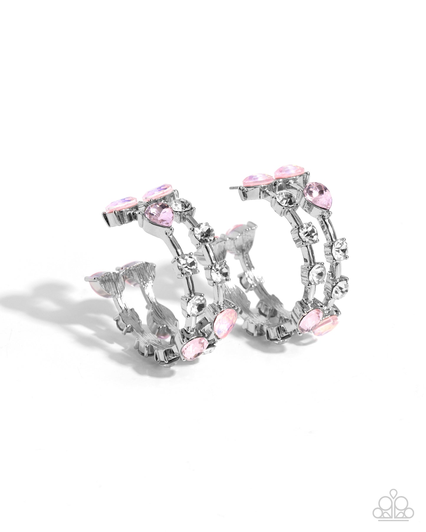 Silver-tone hoop earrings adorned with clear rhinestones and light pink teardrop and oval crystals, shown on a clean white background.