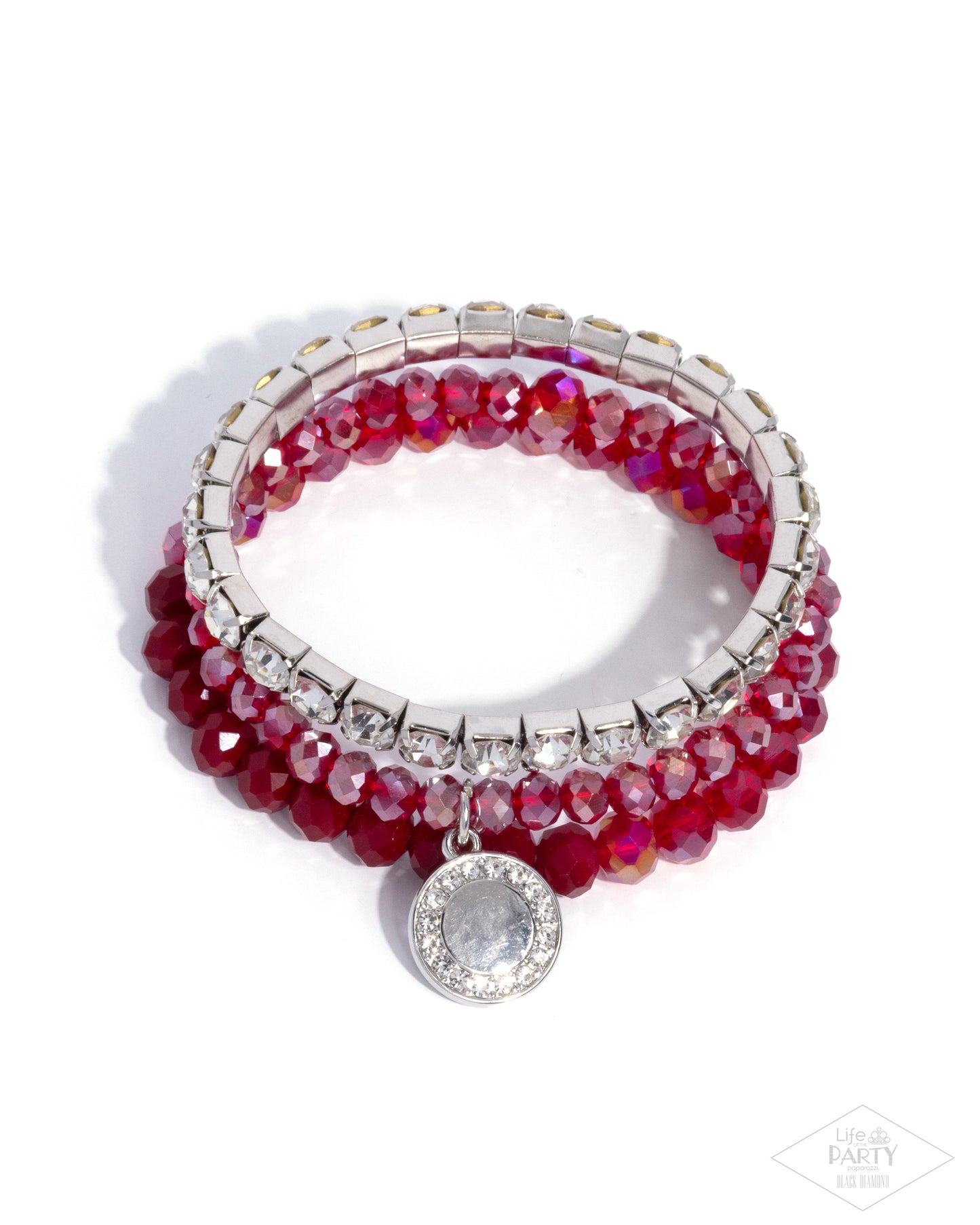 Stack of red beaded bracelets with silver accents on a white background