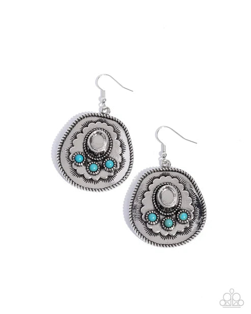 Pair of silver earrings with turquoise stones on a white background