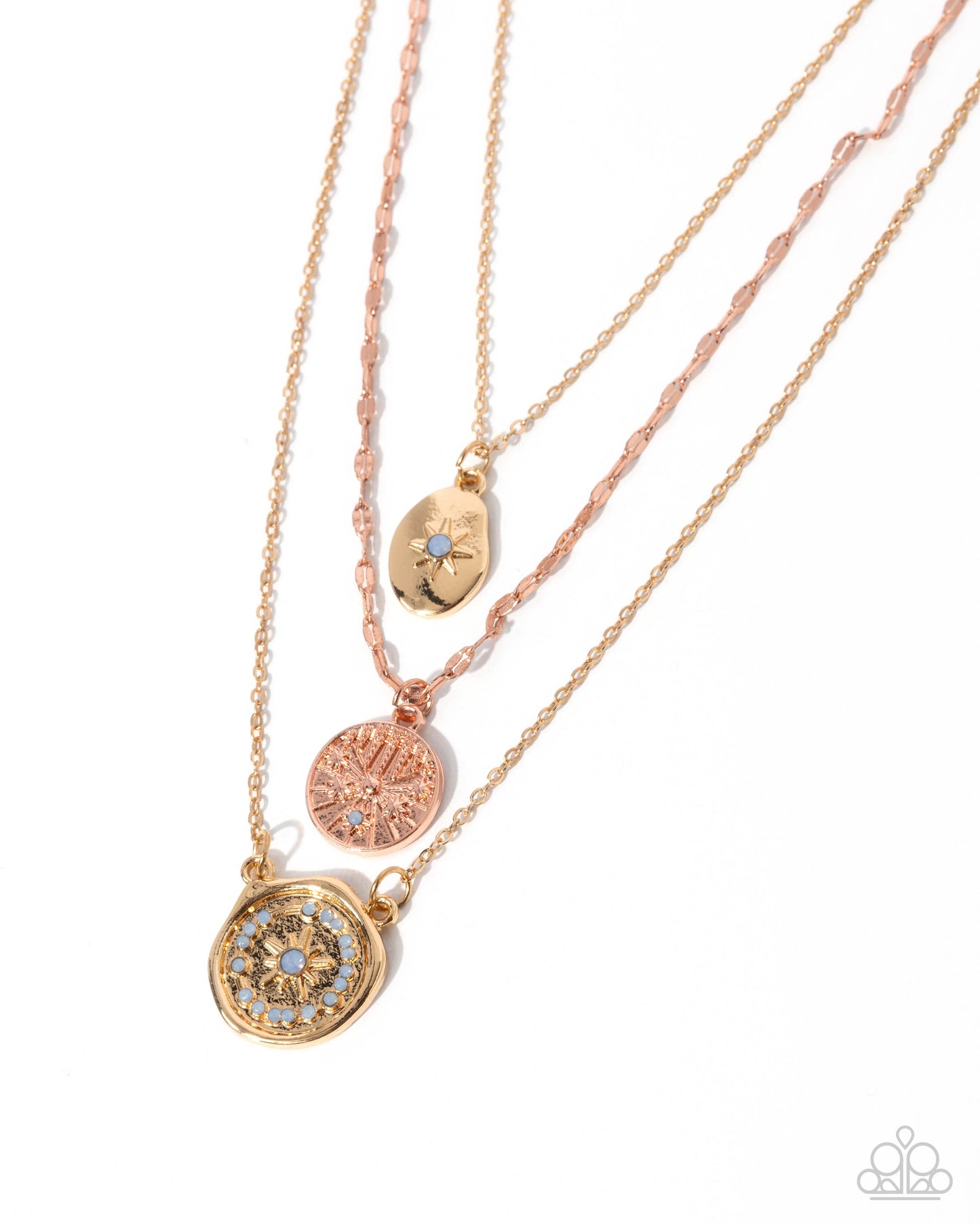 Three rose gold necklaces with circular pendants on a white background