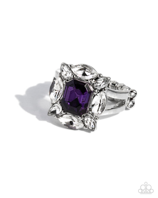 Silver ring with a purple gemstone on a white background