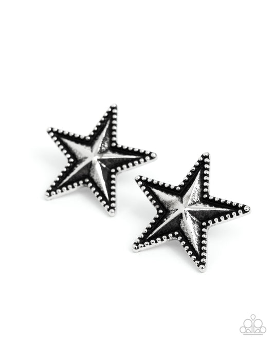 Pair of star-shaped earrings on a white background