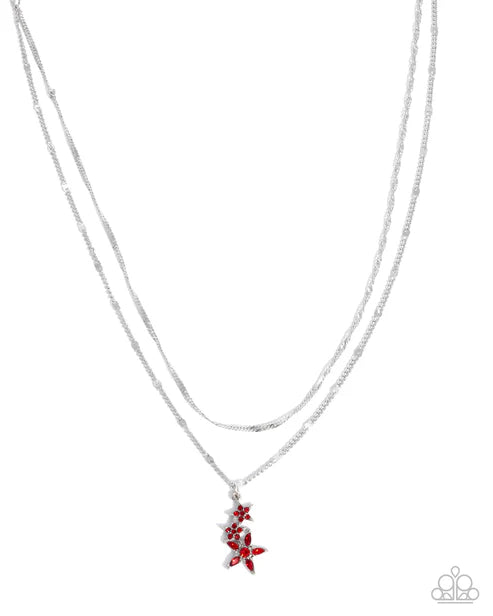 Necklace with red floral pendant on a white background