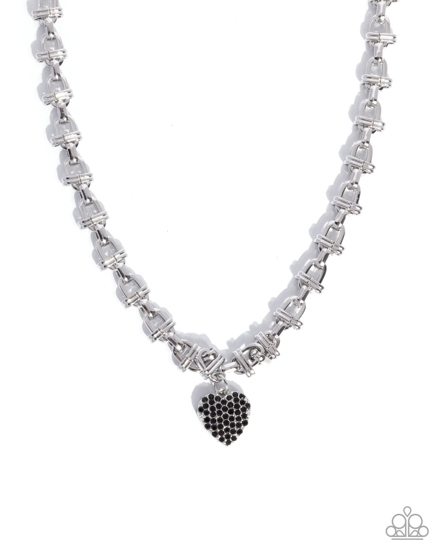 A silver-toned link chain necklace with a small heart-shaped pendant covered in black stones, shown on a plain white background.