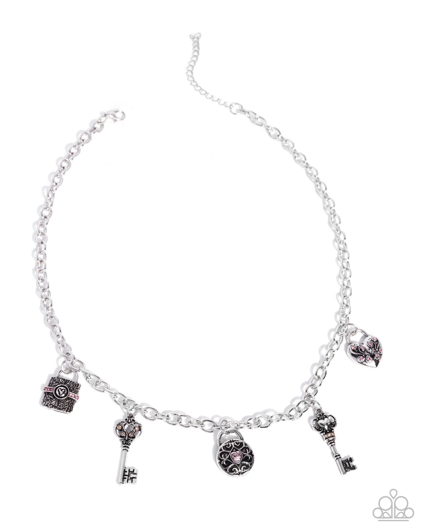 Silver necklace with various charms on a white background