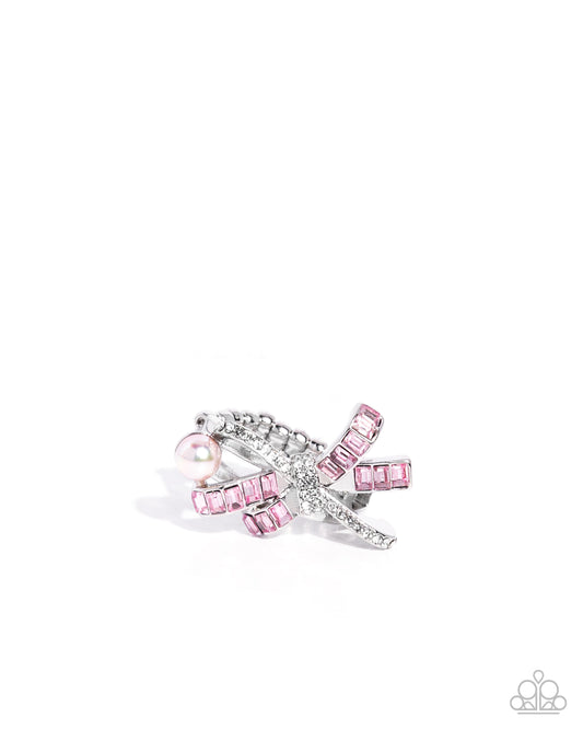 Pink and silver bow-shaped earring on a white background