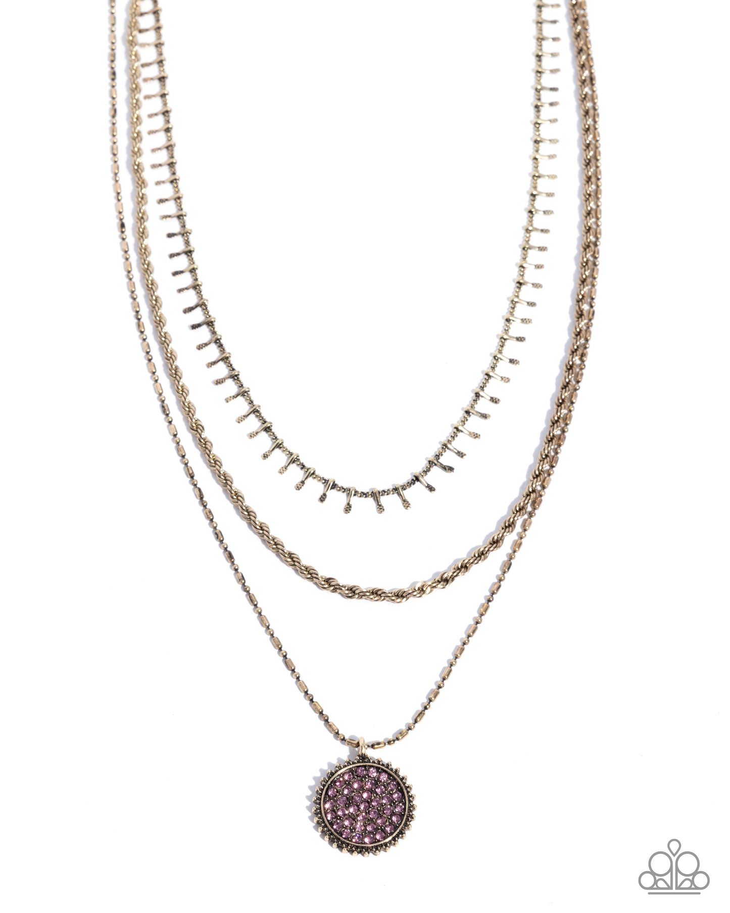 Layered gold necklaces with a purple pendant on a white background
