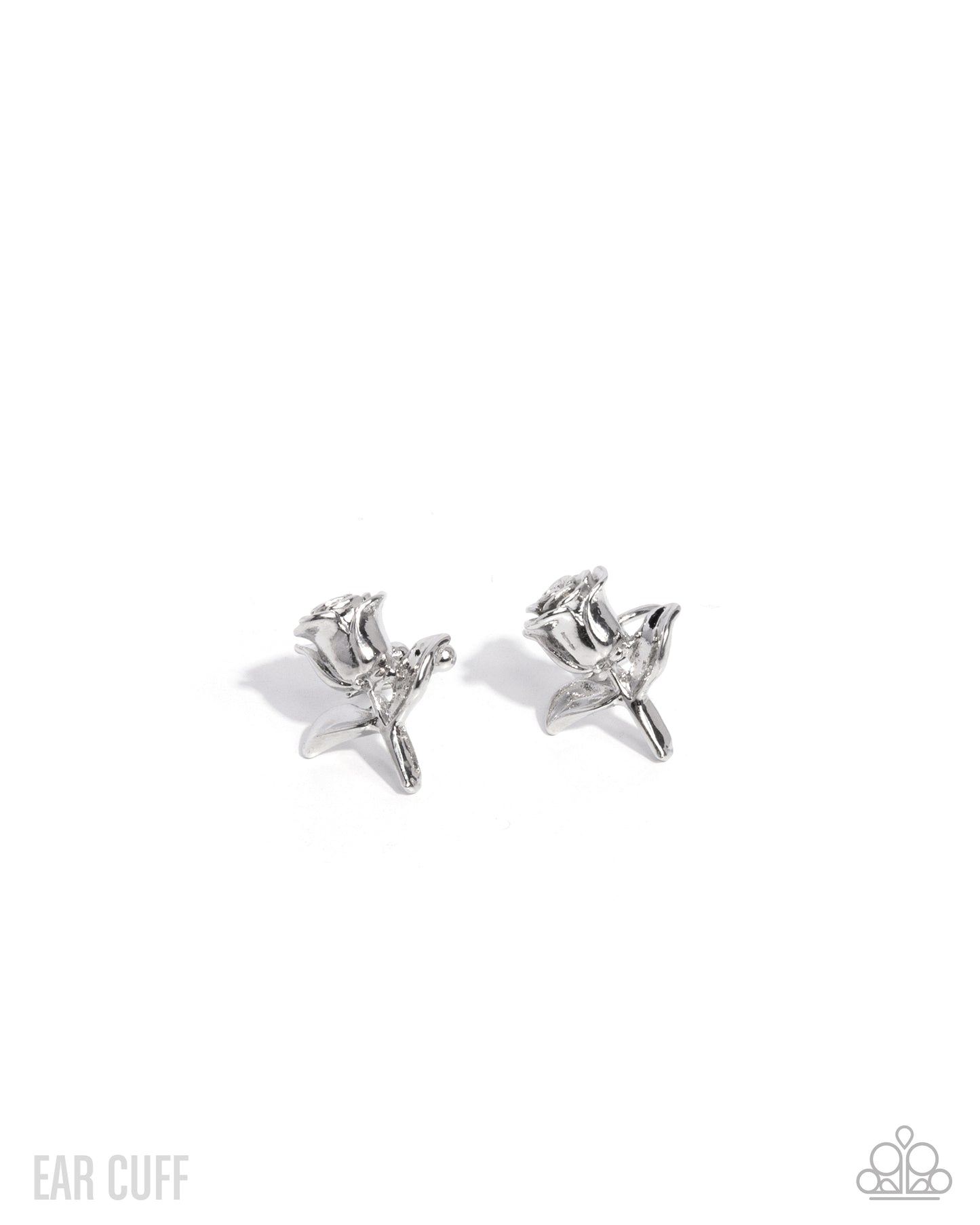 Silver star-shaped ear cuff on a white background