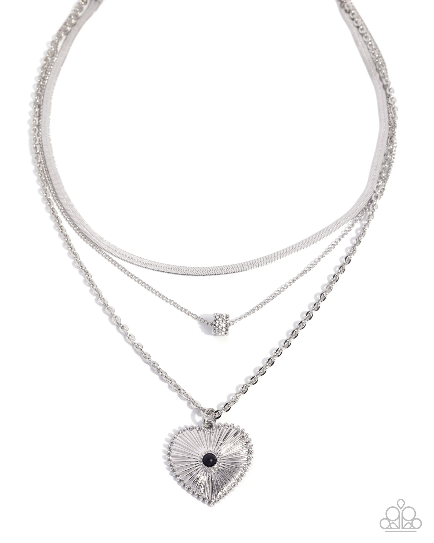 Stack of silver necklaces with heart pendant on a white background